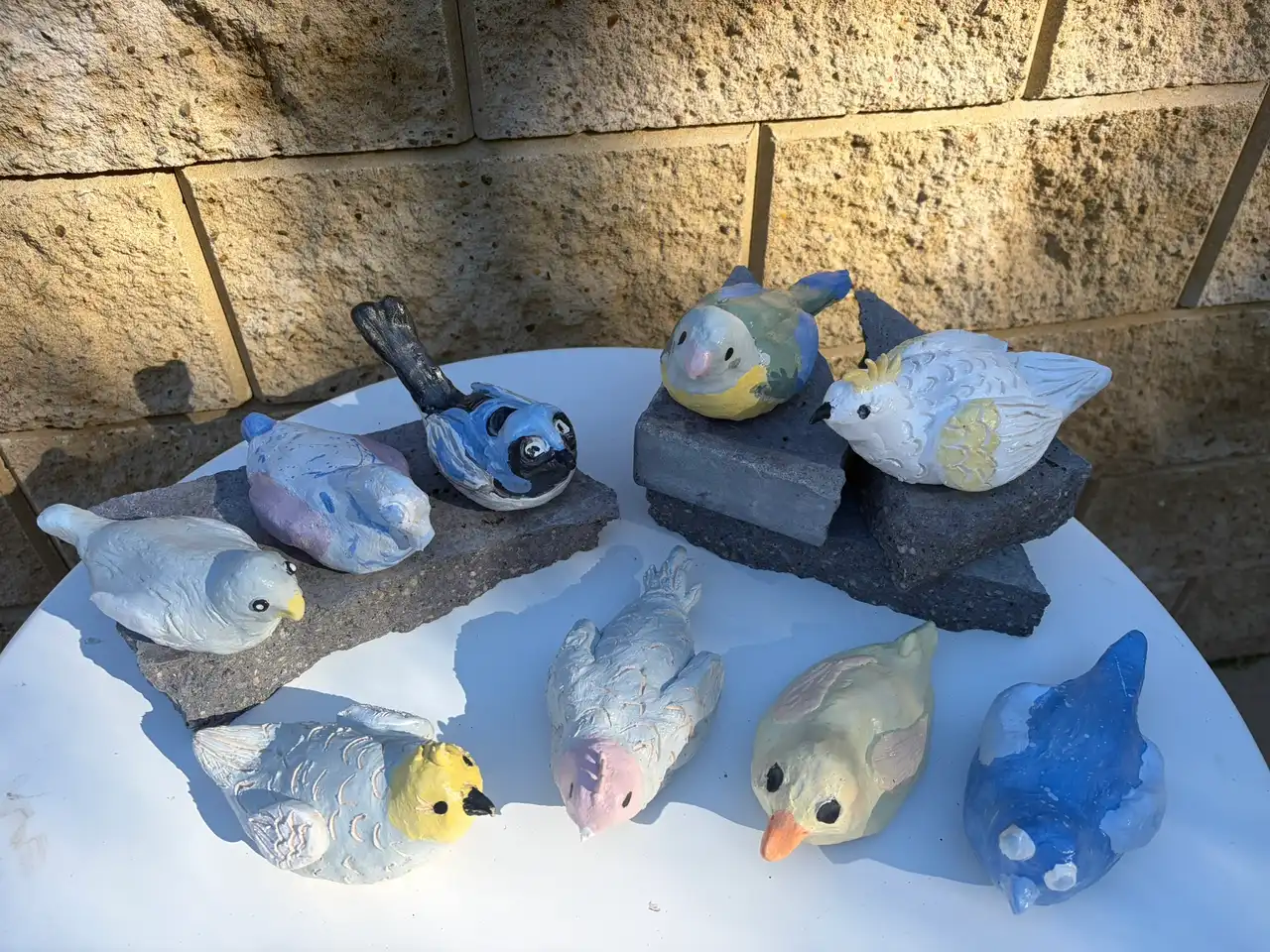 Small glazed ceramic birds made at Kids Club